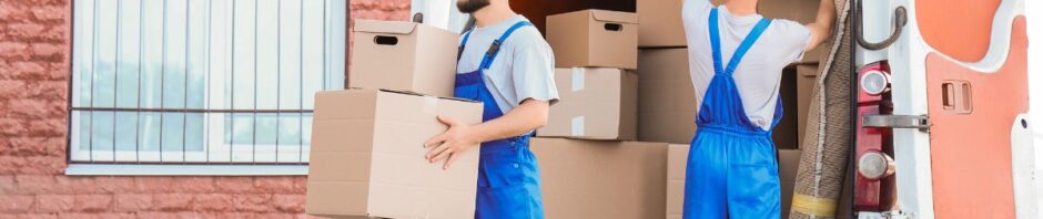 Newark NJ movers packing and loading furniture Jersey City moving team transporting household goods Movers wrapping fragile items for safe relocation Moving truck parked outside a home in Newark NJ
