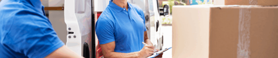 Expert movers and packers in NJ from a top Jersey City moving company carefully pack boxes for a residential move.